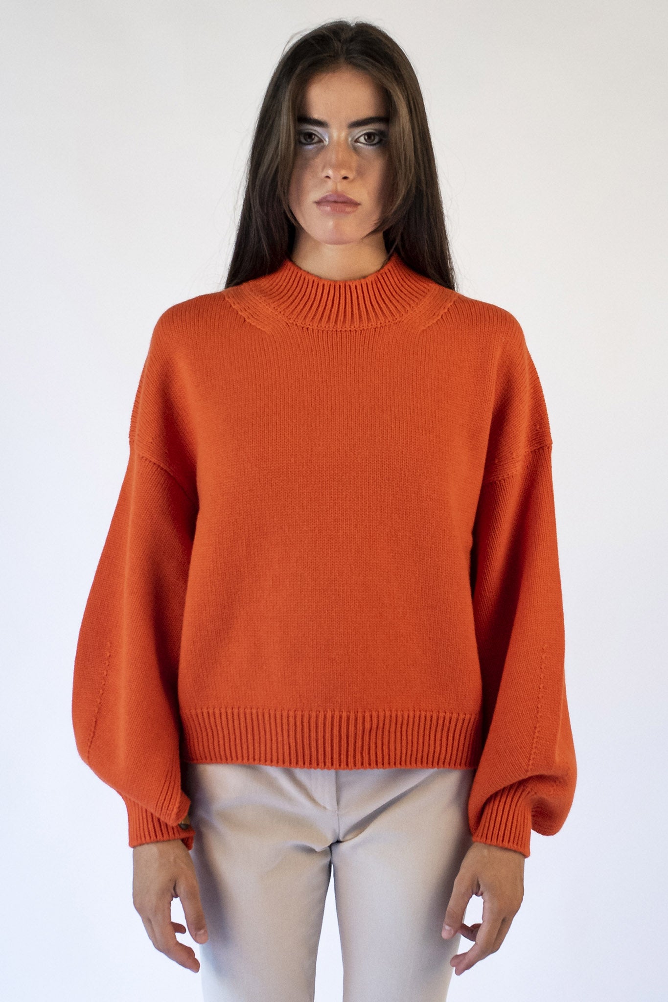 Orange turtleneck sweater with Isabella jewel buttons