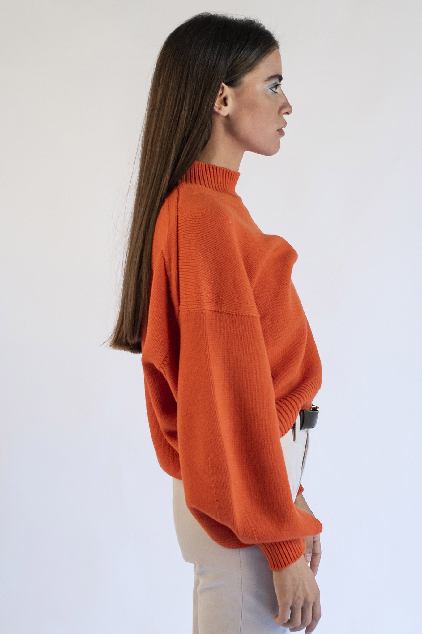 Orange turtleneck sweater with Isabella jewel buttons